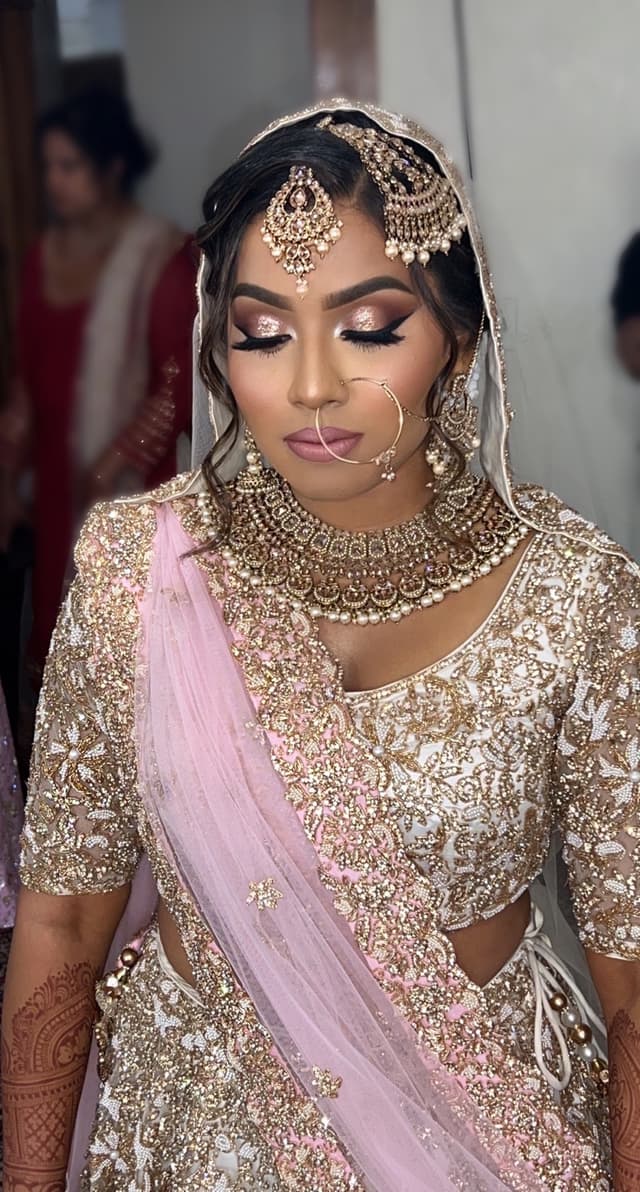 Roko applying lipstick to bride.
